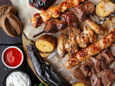 A vibrant spread of grilled skewers and Mediterranean mezze