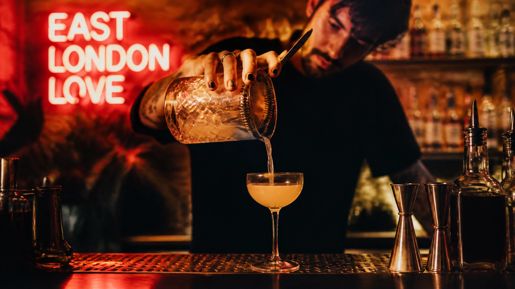 Sophisticated craft cocktail being poured at a trendy bar in Hackney